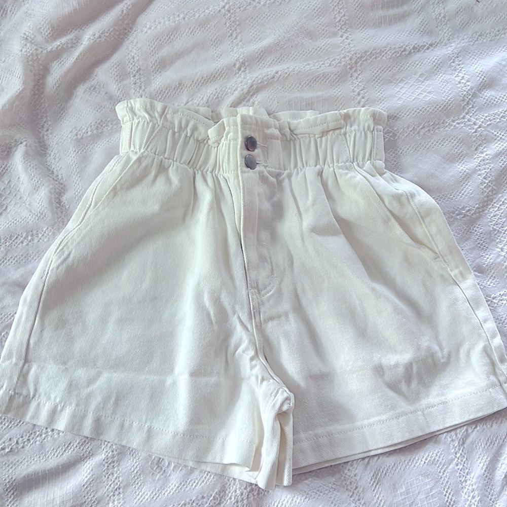 SHEIN high waist white denim shorts.
